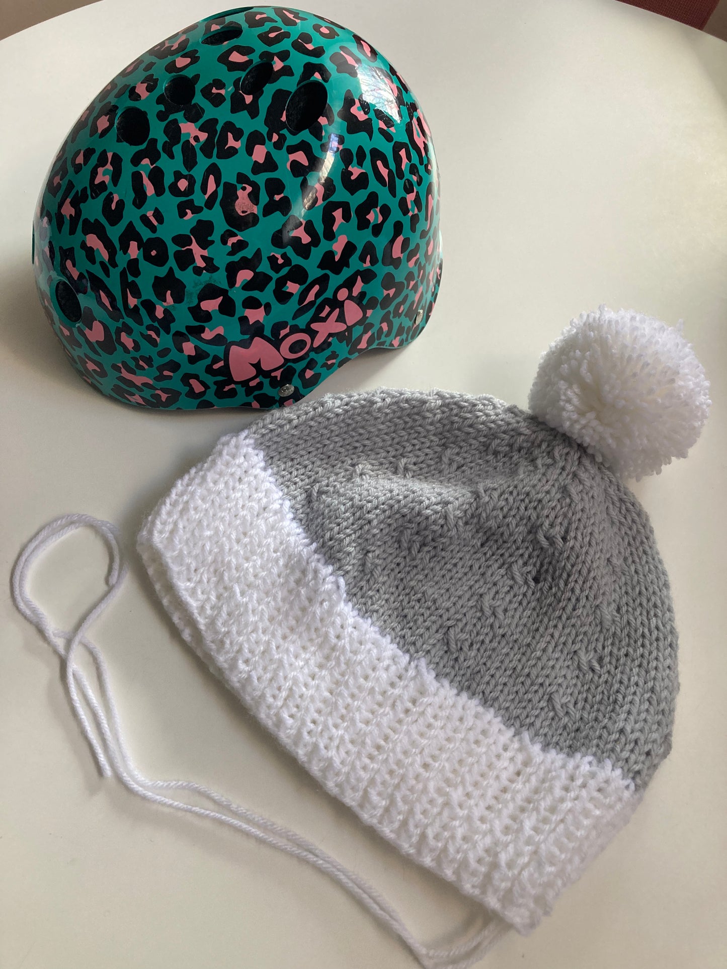 Handknitted Helmet Beanie with Extra Large Pom Pom in Light Gray and Snow White