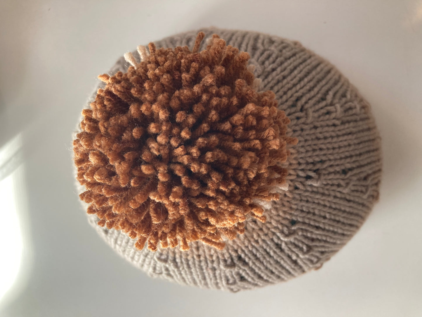 Handknitted Helmet Beanie with Extra Large Pom Pom in Coastal Tans and Gray