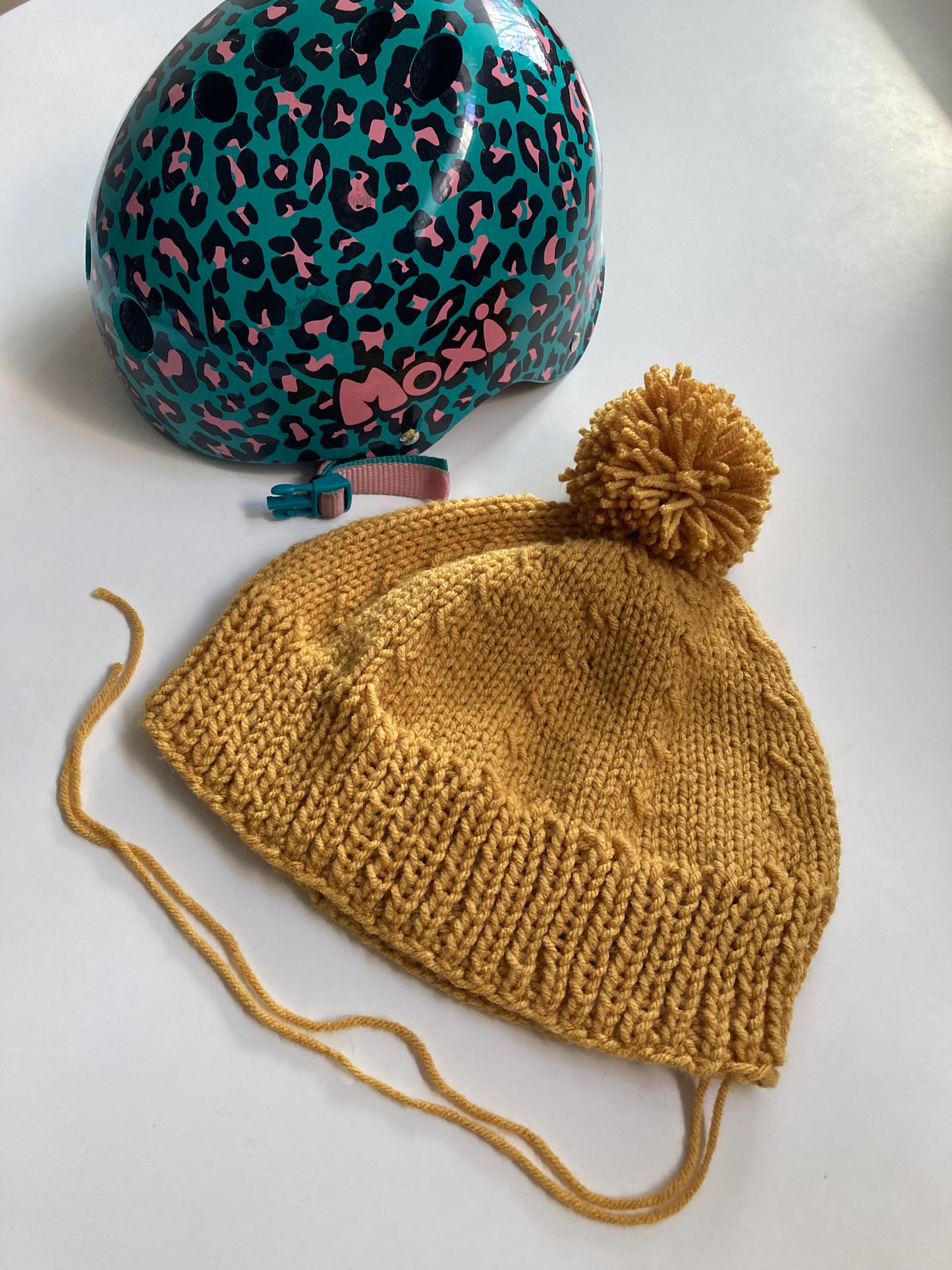 Handknitted Helmet Beanie with Extra Large Pom Pom in Mustard Gold