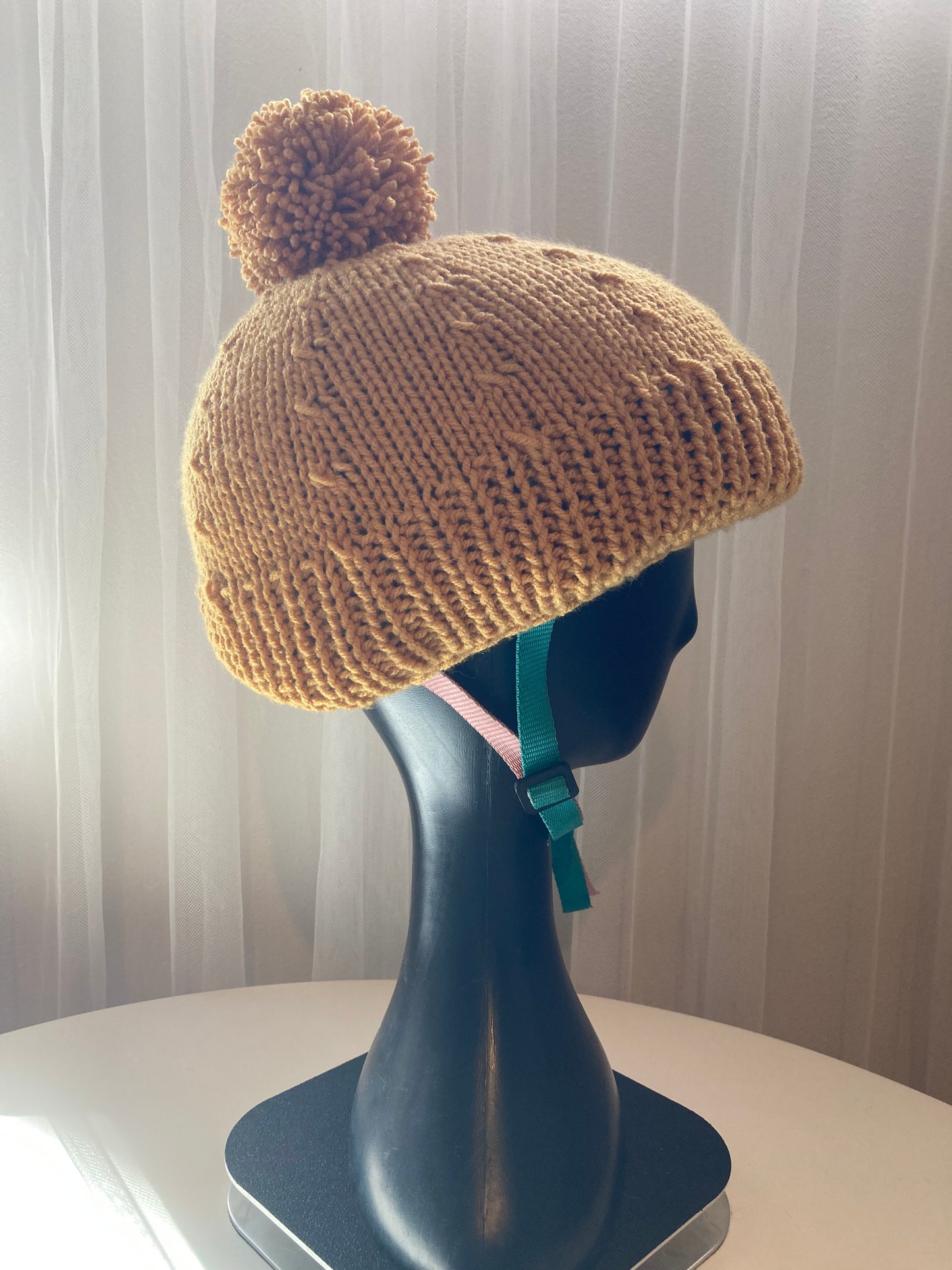 Handknitted Helmet Beanie with Extra Large Pom Pom in Mustard Gold