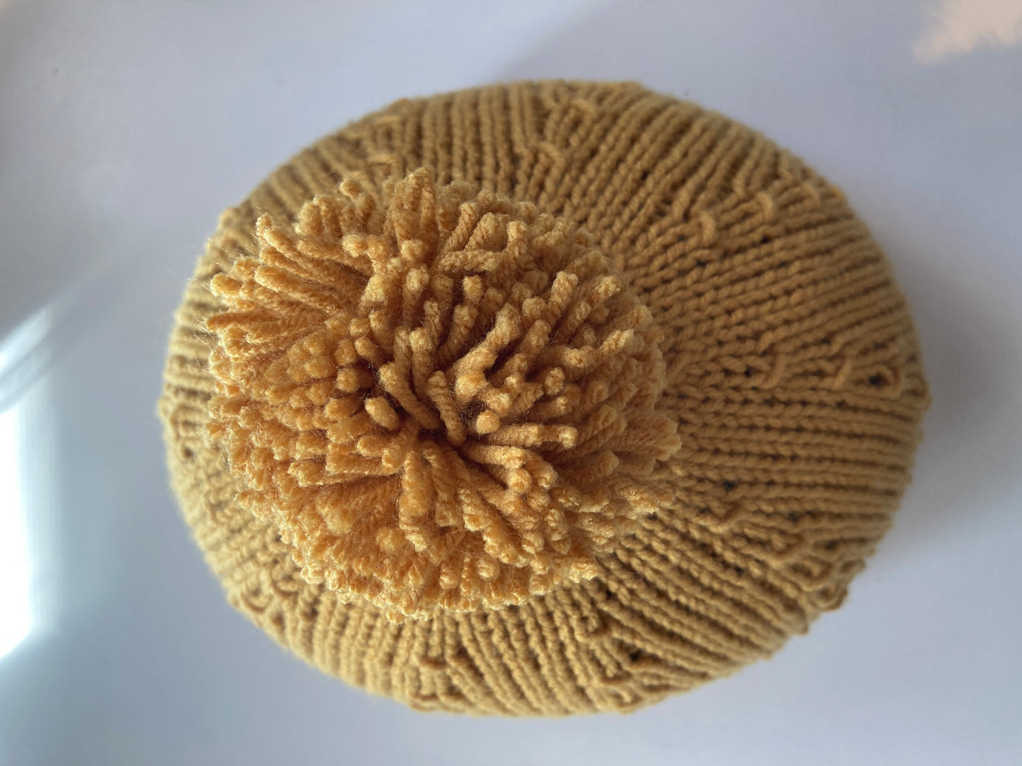 Handknitted Helmet Beanie with Extra Large Pom Pom in Mustard Gold